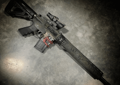 SHARPS BROS "SHOWDOWN" LOWER RECEIVER WITH CUSTOM CERAKOTE AND American Resistance AR15 TAKEDOWN RIFLE WITH DARK MULTICAM CREAKOTE PATTERN AND CRY HAVOC TACTICAL QRB BARREL SYSTEM.