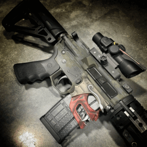 SHARPS BROS "SHOWDOWN" LOWER RECEIVER WITH CUSTOM CERAKOTE AND American Resistance AR15 TAKEDOWN RIFLE WITH DARK MULTICAM CREAKOTE PATTERN AND CRY HAVOC TACTICAL QRB BARREL SYSTEM.